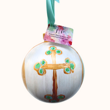 Load image into Gallery viewer, This is a round Cross Christmas ornament with a whimsical Christian cross. It has shades of green and aqua with a gold cross on a white background and abstract design on the beck. It also has a green adjustable ribbon.