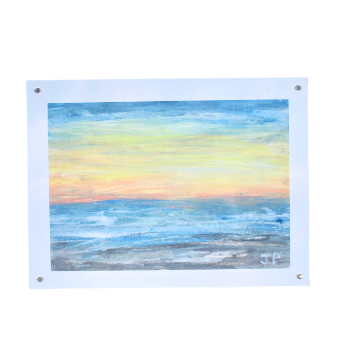 An abstract beach landscape painting on paper. Framed in an acrylic frame. The art has shades of blue, gray, white, yellow, and orange. It is initialed by the artist JP on the front.