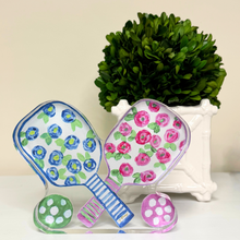 Load image into Gallery viewer, Pickleball Acrylic Block Shelf Sitter โ Vibrant Floral Paddle Art by Jeanne Player"
Enhance your collection with this unique piece that celebrates the fun and spirit of pickleball.  With blue and pink flowers, green leaves, striped handles. a cute gift for girls who play pickleball.