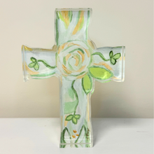 Load image into Gallery viewer, This is a free standing acrylic art block cut out into the shape of a cross. This floral inspired cross has shades of green, gold and white. It is made of acrylic and paper.