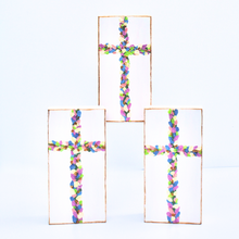 Load image into Gallery viewer, Flowered Crosses are original works of art on wood panels. This image shows 3 crosses on panels with shades of green, pink, coral, blue, purple and gold. It is on a white background and has a gold edge