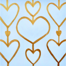 Load image into Gallery viewer, Heart Art Acrylic Block. A 5.5 inch free standing acryic block that has the image of hearts on the background. They are 3 rows of white hearts on a cream background outlined in gold connected by a gold line. This shelf sitter is styled on a mirrored tray beside a clear glass vase holding white orchids. This is a copy of the Heartstrings XIi painting make into an acrylic block.