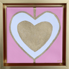 Load image into Gallery viewer, Heart Art painting on Canvas. This original heart artwork has a gold heart inside a white heart outlined in gold on a pink background. It is a square painting and comes in a gold float frame. It is initialed by the artist on the front.
