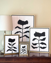 Load image into Gallery viewer, Neutral black and white flower paintings. Set of framed black floral artworks on a wall with a lamp and decorative items.