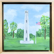 Load image into Gallery viewer, NC State Bell tower painting. This abstract landscape painting of the Bell Tower is square and has shades of green, blue, wihite Brown and red.  It features the NCU bell tower with an American flag on the side. It is an original painting and comes in a natural float frame.
