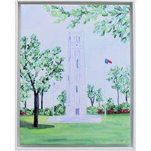 Load image into Gallery viewer, This is a vertical giclee art print of the NC State Memorial Belltower in Raleigh NC. It is a landscape with the belltower, a US Flag and an NC Flag, with trees and red blooming azaleas.