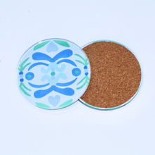 Load image into Gallery viewer, Two colorful lucite coasters one showing the front image and one showing the back cork image. This coasters are round and have shades of blue and green on a white background.