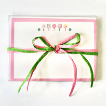 Load image into Gallery viewer, This is a cute and preppy stationery set of 10 flat note cards designed by Jeanne Player Fine Art. These cards have five colorful pickleball paddles and two green balls. The border is outlined in pink. The set has cute packaging with a pink and green raffia bow.