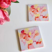 Load image into Gallery viewer, cute and colorful ceramic and cork coaster set. Pink, yellow and orange coasters on a white background..
