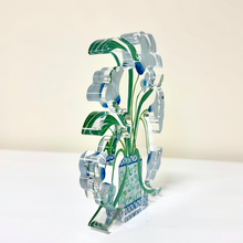 Load image into Gallery viewer, Belle Fleurs acrylic art block by Jeanne Player featuring whimsical white flowers in a blue and green patterned vase with royal blue lattice details on a light blue background.