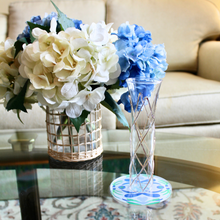 Load image into Gallery viewer, Blue botanical acrylic drink coasters with cork backing and a glossy finish, adding colorful coastal style to any kitchen, living room, or bar cart.
