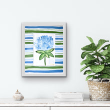 Load image into Gallery viewer, Original floral artwork on watercolor paper featuring a blue hydrangea bloom and fresh green botanical details.
Cottagecore hydrangea wall art with playful hand-painted mat in blue and green stripes on white background.