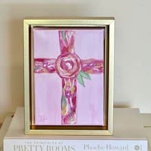Load image into Gallery viewer, Hand painted pink cross artwork with floral details and gold accents framed in gold float frame