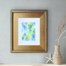 Load image into Gallery viewer, Colorful abstract artwork matted in white featuring vibrant yellow, blue, green, and white tones in a contemporary expressive style.
