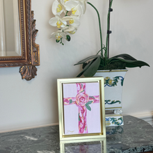 Load image into Gallery viewer, Gold framed Christian cross painting in pink, red, green, white and gold, perfect for a prayer space or shelf.
