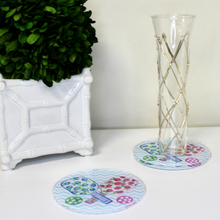Load image into Gallery viewer, Round pickleball acrylic coaster featuring pink and blue floral paddle artwork and a colorful chevron background