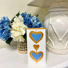 Load image into Gallery viewer, Whimsical heart artwork with royal blue hearts, metallic gold accents, and hand-painted gold sides.