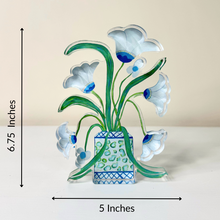 Load image into Gallery viewer, Freestanding floral acrylic art block with white blooms, soft pink accents, lime green dots, and a designer-inspired blue patterned cachepot for colorful shelf decor.