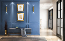 Load image into Gallery viewer, two gold botanical paintings in gold frames styled on a blue wall in an elegent foyer.

