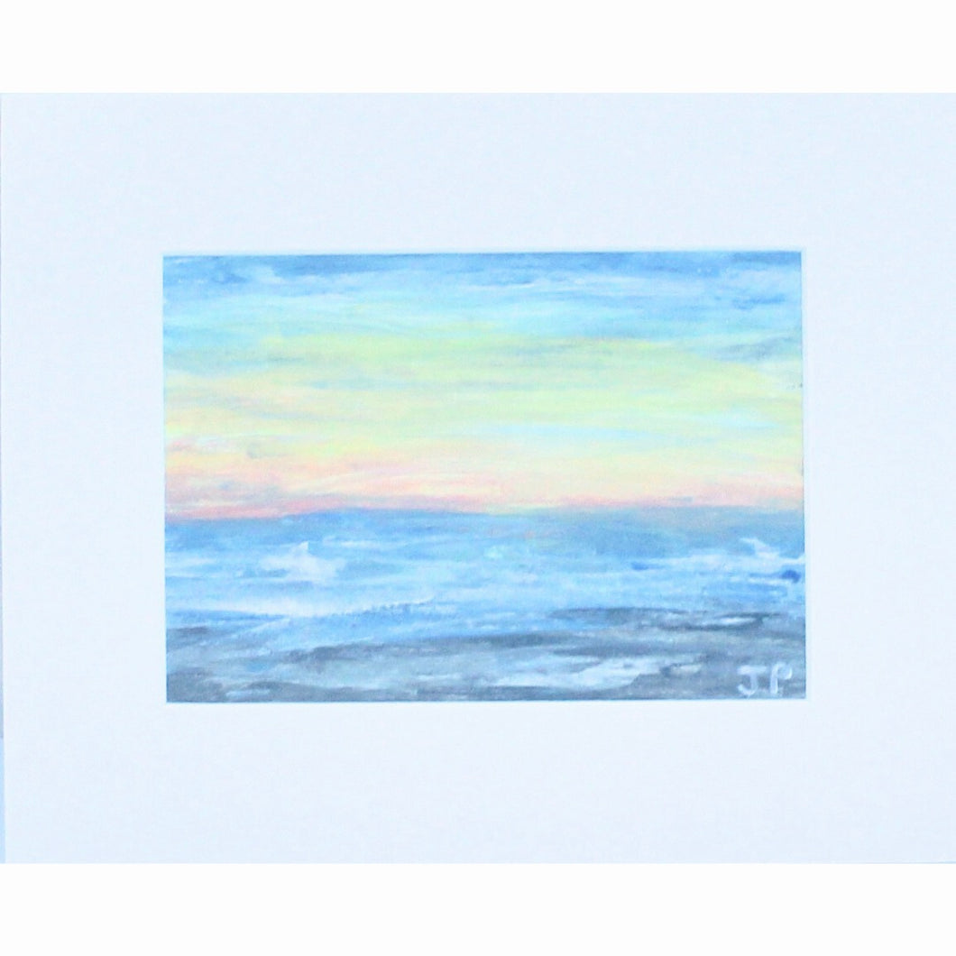 Beach Sunset is an abstract landscape painting on paper. This coastal inspired painting has shades of gray, blue, yellow, orange,  and white. It is in a white mat. It is a horizontal painting.