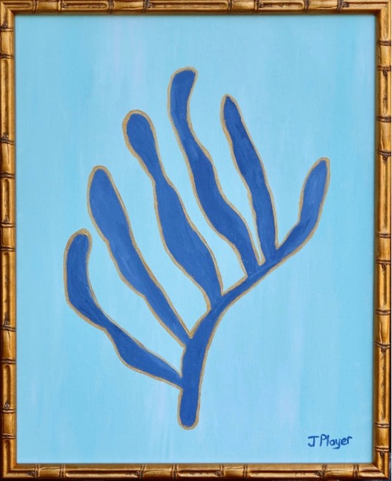 This is a bold and preppy seaweed art design on canvas. This painting has shades of light blue in the background and dark blue seaweed shape outlined in gold. It is in a gold bamboo frame. It is inspired by Matisse's cut out series.