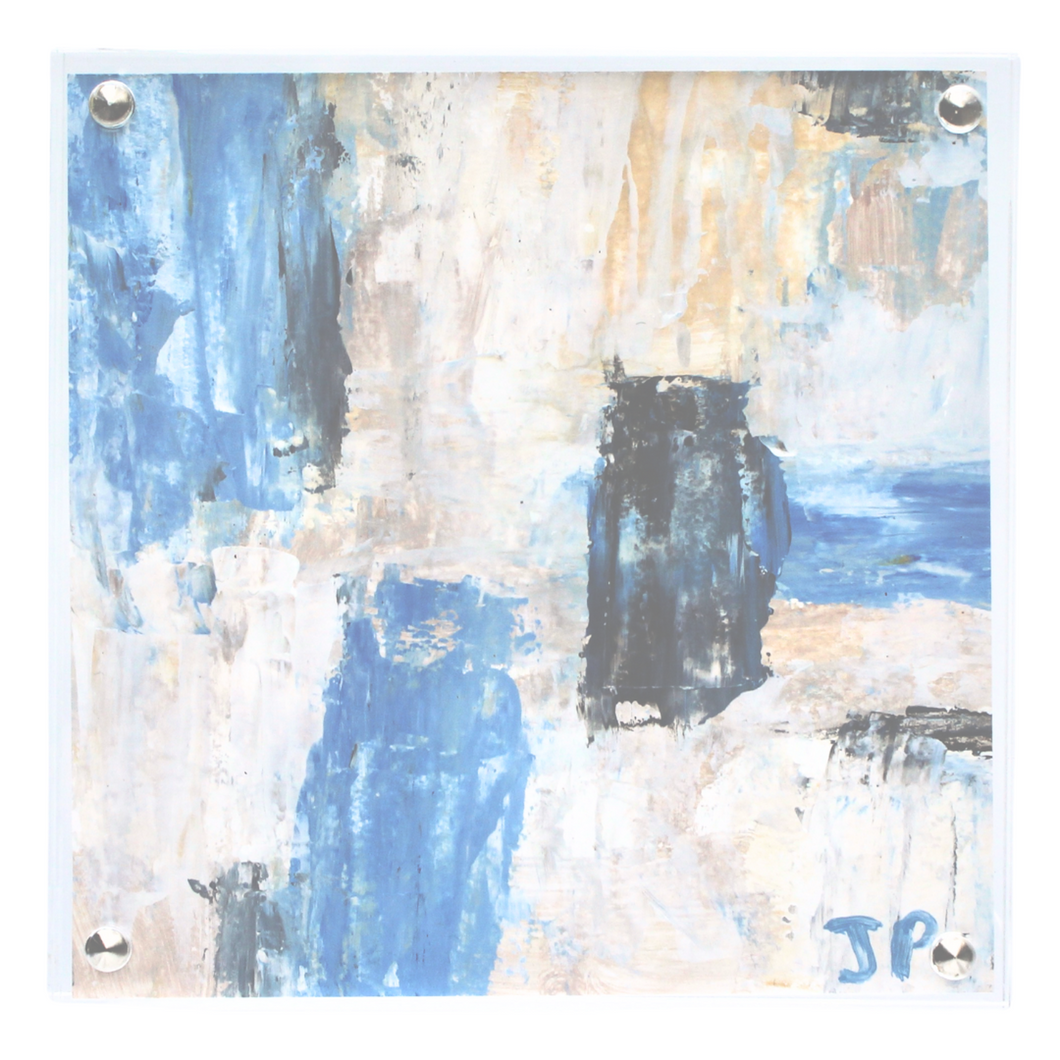 square abstract painting on paper in an acrylic frame. This painting has shades of blue, black gray white, yellow and tan. It is initailed by the artist on the front.