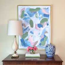 Load image into Gallery viewer, Modern abstract painting on gallery-wrapped canvas with soft blended colors of blue, rose, green, white, brown, and hints of orange and yellow in a gold float frame.
