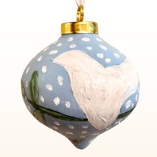 Load image into Gallery viewer, White dove Christmas ornament hanging on tree branch, original hand painted ceramic with symbolic design of peace and purity.
