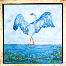 Load image into Gallery viewer, This is a square painting on canvas, it feautures a whimiscal blue heron who appears to be dancing in shallow water. There are also lily pads with pink flowers in the water.  
