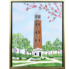 Load image into Gallery viewer, The University of Alabama&#39;s Belltower, Denny Chimes. This is an abstract landscape painting of the Belltower.  The belltower  has a brick center and is white at the top and bottom. It is pictured on The Quad with sidewalks, flowers, trees, shrubbery and blooming tree branches. You also see 6 light post. 
