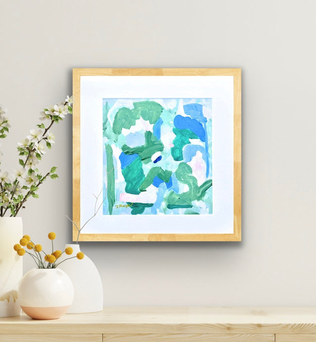 This is a square colorful abstract artwork on paper. It has shades of green,blue, white and pink. It is signed by the artist on the front.