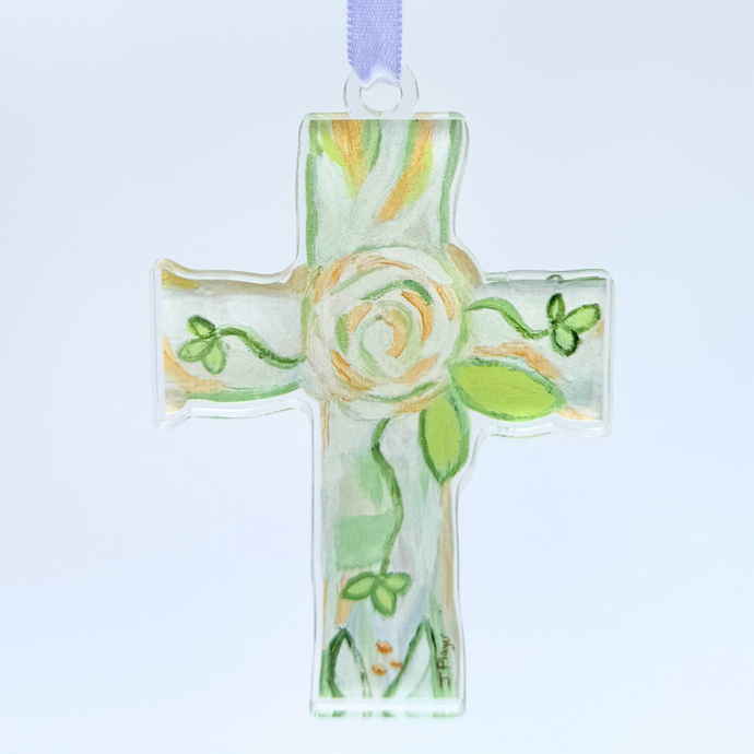 This is the faith cross, it has a green, white and gold floral design, a cross cut out shape, made for high quality acrylic. it is lighweight and shatterproof. It comes with a satin ribbon.