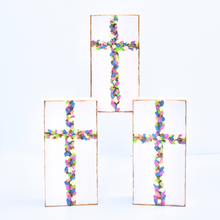 Load image into Gallery viewer, Flowered Crosses are original works of art on wood panels. This image shows 3 crosses on panels with shades of green, pink, coral, blue, purple and gold. It is on a white background and has a gold edge
