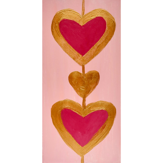 Heart Art. A 2. 5 x 7.5 vertical free standing acrylic block with a pink background and two red hearts outlined in gold connected by a gold line.