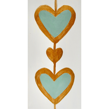 Load image into Gallery viewer, Bold Heart Original Art. This small vertical painting has two green hearts outlined in gold with a gold heart between them. It is on a white background with gold sides.
