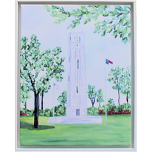 Load image into Gallery viewer, This is a vertical giclee art print of the NC State Memorial Belltower in Raleigh NC.  It is a landscape with the belltower, a US Flag and an NC Flag, with trees and red  blooming azaleas.
