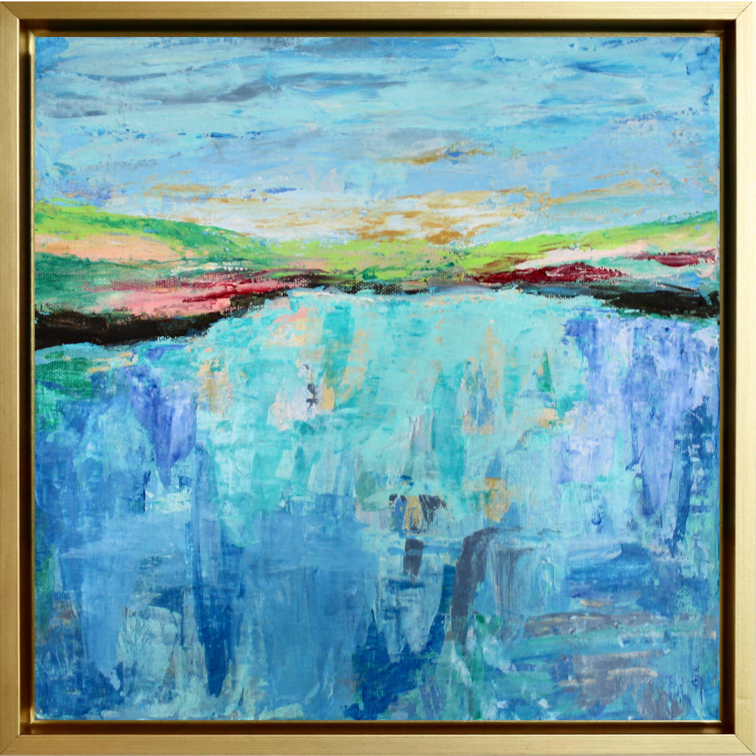 On the Water is an abstract expressionist style painting on canvas. It is in a gold float frame. It has shades of blue, green, brown, black, gray, white, yellow, pink and red. It is an abstract ocean painting. This square abstract coastal painting is the perfect pop of color for a small space.