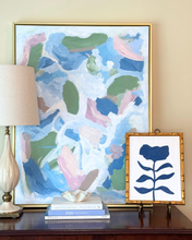 Load image into Gallery viewer, Beautiful floral art styled with a lamp, books and abstract art.
