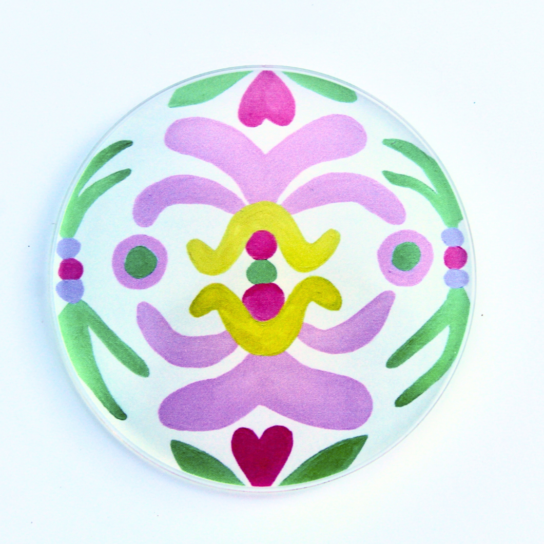 A round Acrylic Coaster with a  Colorful abstract art design called Palm Beach Design. It measures 4 inches and has a cork botttom. These coasters have shades of pink, green, purple, yellow and red.