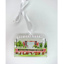Load image into Gallery viewer, Acrylic Christmas ornament featuring Jeanne Player’s original Saban Field painting of Bryant-Denny Stadium at the University of Alabama. Lightweight cut-out design with red, green, white, black, and gray colors, finished with a satin ribbon for hanging. Perfect for Alabama fans, graduates and students. Roll Tide!
