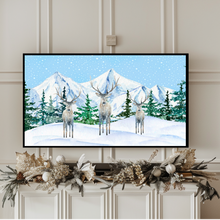 Load image into Gallery viewer, Winter Wonderland Digital Download for TV.  This is a snowy winter scene with 3 deer, standing in the snow with evergreen trees and mountains in the background.   Snow is falling all around. This artwork has shades of blue, green, white, tan, and gray.
