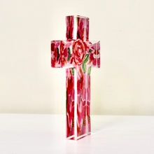 Load image into Gallery viewer, Side view of  Love Cross acrylic block showing pink, red, green and gold floral details surrounding a Christian cross.
