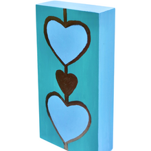 Load image into Gallery viewer, Original acrylic heart painting featuring whimsical blue hearts outlined in metallic gold tones.
Modern coastal artwork on wood panel with layered heart motifs and vibrant turquoise background.
