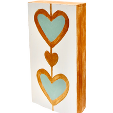 Load image into Gallery viewer, Hand-painted modern heart art on wood panel featuring playful gold and mint green abstract hearts.
Contemporary pop art heart painting perfect for shelf decor, tabletop styling, and unique gift ideas.
