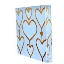 Load image into Gallery viewer, Modern Valentine’s Day gift featuring Heartstrings XII acrylic block art with elegant gold and white hearts, a unique keepsake for anniversaries, birthdays, and housewarmings.
