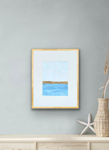 Load image into Gallery viewer, Golden Blue original mixed media abstract seascape by Jeanne Player, featuring blue water, a soft blue sky, and a gold leaf horizon, matted for an 11 x 14 inch frame
