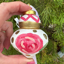 Load image into Gallery viewer, One-of-a-kind hand-painted Christmas ornament featuring abstract floral artwork with pink flowers, green leaves, and shimmering gold details.
