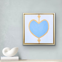 Load image into Gallery viewer, Original blue and gold heart painting on canvas in a gold float frame by Jeanne Player Fine Art.
Contemporary square heart artwork featuring a soft blue heart outlined in gold on white canvas.
