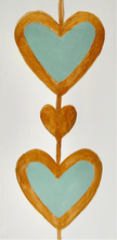 Load image into Gallery viewer, Bold Heart Original Art. This small vertical painting has two green hearts outlined in gold with a gold heart between them. It is on a white background with gold sides. heart art painting original

