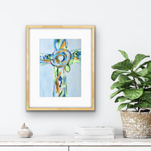 Load image into Gallery viewer, Colorful Hope Cross Christian art print displayed in a girl's bedroom, featuring a contemporary floral cross in blue, green, gold, and white.
